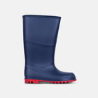Classic Wellies Navy, a single rubber wellington boot in navy blue with a bright red sole, isolated on a light background.